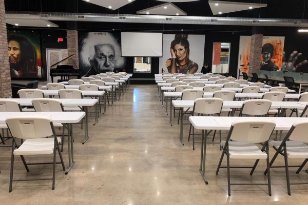 tables and chairs set up facing front seminar screen